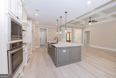 Nestled on 2.22 acres, this exquisite new construction two-story on Perry Country Club in Georgia - for sale on GolfHomes.com, golf home, golf lot