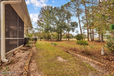 Welcome to this charming brick home located right on the Timber on Pass Christian Isles Golf Club in Mississippi - for sale on GolfHomes.com, golf home, golf lot