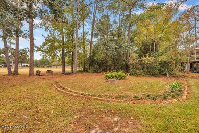 Welcome to this charming brick home located right on the Timber on Pass Christian Isles Golf Club in Mississippi - for sale on GolfHomes.com, golf home, golf lot