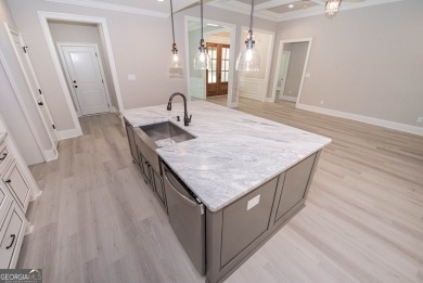 Nestled on 2.22 acres, this exquisite new construction two-story on Perry Country Club in Georgia - for sale on GolfHomes.com, golf home, golf lot