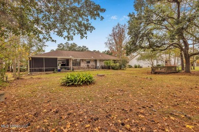 Welcome to this charming brick home located right on the Timber on Pass Christian Isles Golf Club in Mississippi - for sale on GolfHomes.com, golf home, golf lot
