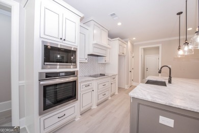 Nestled on 2.22 acres, this exquisite new construction two-story on Perry Country Club in Georgia - for sale on GolfHomes.com, golf home, golf lot