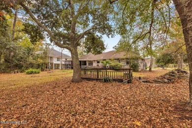 Welcome to this charming brick home located right on the Timber on Pass Christian Isles Golf Club in Mississippi - for sale on GolfHomes.com, golf home, golf lot