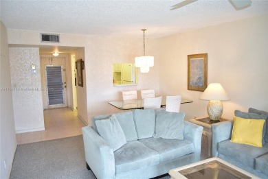 FIRST FLOOR CORNER unit within walking distance to the main on Sunrise Lakes Phase III in Florida - for sale on GolfHomes.com, golf home, golf lot