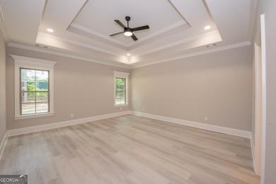 Nestled on 2.22 acres, this exquisite new construction two-story on Perry Country Club in Georgia - for sale on GolfHomes.com, golf home, golf lot