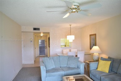 FIRST FLOOR CORNER unit within walking distance to the main on Sunrise Lakes Phase III in Florida - for sale on GolfHomes.com, golf home, golf lot