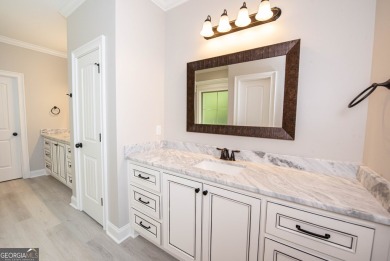 Nestled on 2.22 acres, this exquisite new construction two-story on Perry Country Club in Georgia - for sale on GolfHomes.com, golf home, golf lot
