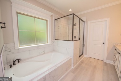 Nestled on 2.22 acres, this exquisite new construction two-story on Perry Country Club in Georgia - for sale on GolfHomes.com, golf home, golf lot