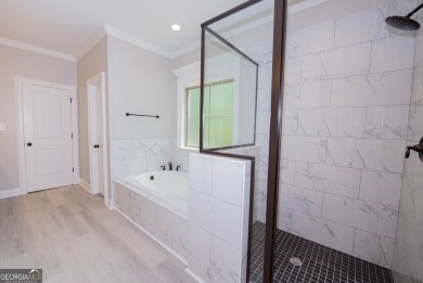 Nestled on 2.22 acres, this exquisite new construction two-story on Perry Country Club in Georgia - for sale on GolfHomes.com, golf home, golf lot