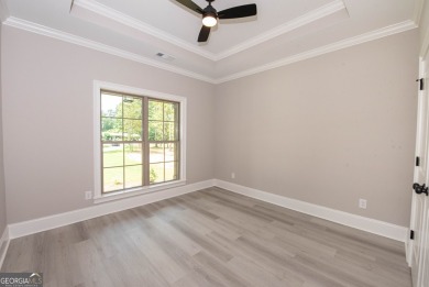 Nestled on 2.22 acres, this exquisite new construction two-story on Perry Country Club in Georgia - for sale on GolfHomes.com, golf home, golf lot