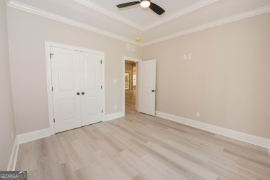 Nestled on 2.22 acres, this exquisite new construction two-story on Perry Country Club in Georgia - for sale on GolfHomes.com, golf home, golf lot