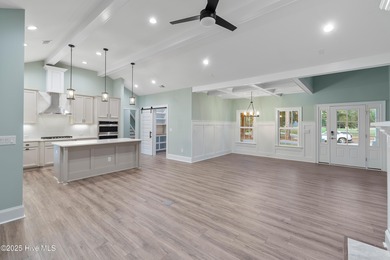 This brand new Riptide home with stunning setting and finishes on Sea Trail Golf Resort in North Carolina - for sale on GolfHomes.com, golf home, golf lot