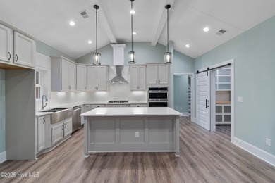 This brand new Riptide home with stunning setting and finishes on Sea Trail Golf Resort in North Carolina - for sale on GolfHomes.com, golf home, golf lot