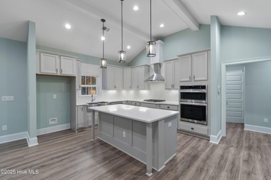 This brand new Riptide home with stunning setting and finishes on Sea Trail Golf Resort in North Carolina - for sale on GolfHomes.com, golf home, golf lot