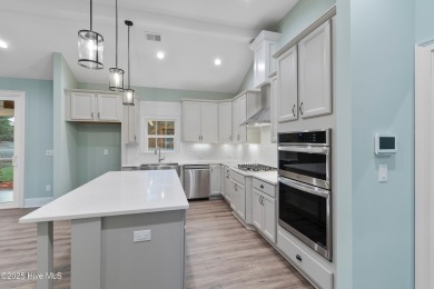 This brand new Riptide home with stunning setting and finishes on Sea Trail Golf Resort in North Carolina - for sale on GolfHomes.com, golf home, golf lot