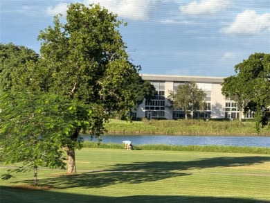 YOU CAN CHANGE THE INSIDE BUT CAN'T CHANGE THE OUTSIDE. Original on Wynmoor Golf Course in Florida - for sale on GolfHomes.com, golf home, golf lot