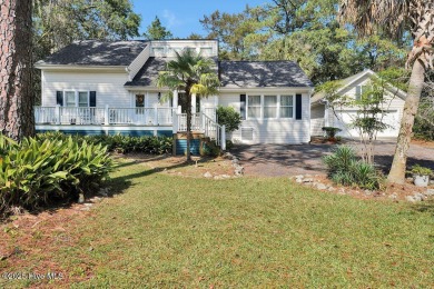Tucked beneath the canopy of Southport's iconic old-growth oak on The Lakes Country Club in North Carolina - for sale on GolfHomes.com, golf home, golf lot