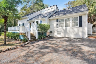 Tucked beneath the canopy of Southport's iconic old-growth oak on The Lakes Country Club in North Carolina - for sale on GolfHomes.com, golf home, golf lot