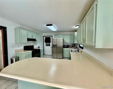 This 4-bedroom, 3-bath beauty in the desirable Fairway Estates on Bent Creek Golf Course in Missouri - for sale on GolfHomes.com, golf home, golf lot