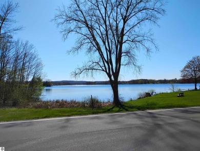 Beautiful lot at all sports private Lake Isabella with road on The Pines Golf Course at Lake Isabella in Michigan - for sale on GolfHomes.com, golf home, golf lot