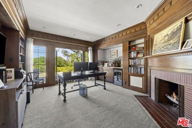 Tucked behind lush landscaping on one of the most coveted and on Los Angeles Country Club in California - for sale on GolfHomes.com, golf home, golf lot