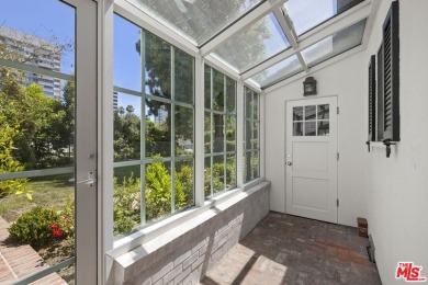 Tucked behind lush landscaping on one of the most coveted and on Los Angeles Country Club in California - for sale on GolfHomes.com, golf home, golf lot