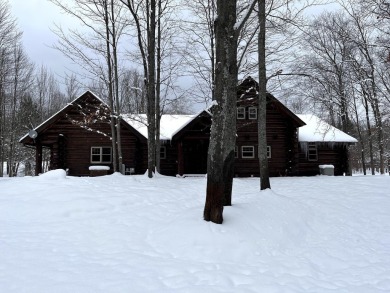 Amazing fully furnished log home on the 6th tee of Garland's on Garland Resort and Golf Club  in Michigan - for sale on GolfHomes.com, golf home, golf lot