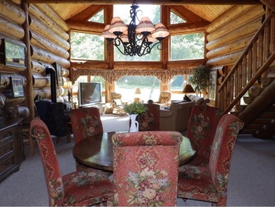 Amazing fully furnished log home on the 6th tee of Garland's on Garland Resort and Golf Club  in Michigan - for sale on GolfHomes.com, golf home, golf lot