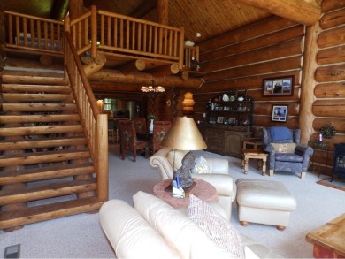 Amazing fully furnished log home on the 6th tee of Garland's on Garland Resort and Golf Club  in Michigan - for sale on GolfHomes.com, golf home, golf lot