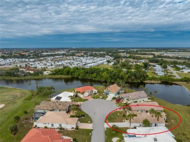 Introducing this serene haven at 10214 Windsong Rd, Punta Gorda on Seminole Lakes Country Club in Florida - for sale on GolfHomes.com, golf home, golf lot