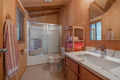 This stunning, fully furnished 4 bed and 2 bath lakefront chalet on Innsbrook Resort Golf Course in Missouri - for sale on GolfHomes.com, golf home, golf lot