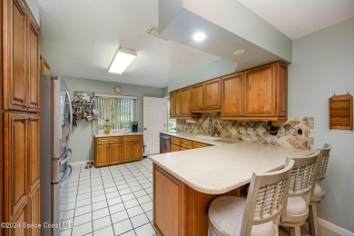 Located in a military, country club community, this charming on Indian River Colony Club in Florida - for sale on GolfHomes.com, golf home, golf lot