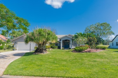 Indulge in Luxury Living in Country Club Estates! This stunning on St. Lucie Trail Golf Club in Florida - for sale on GolfHomes.com, golf home, golf lot