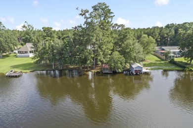 Lakefront Living... Welcome home to this 3BD / 2BA with separate on Pine Creek Golf Club in Mississippi - for sale on GolfHomes.com, golf home, golf lot