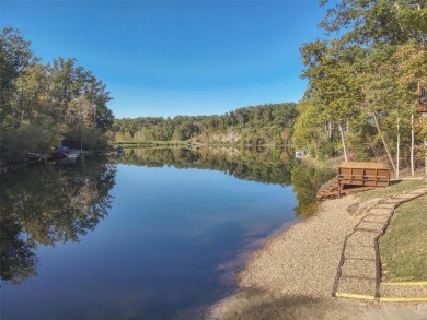 This stunning, fully furnished 4 bed and 2 bath lakefront chalet on Innsbrook Resort Golf Course in Missouri - for sale on GolfHomes.com, golf home, golf lot