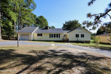 Excellent price on updated golf front beauty! Located just on Seven Lakes Country Club in North Carolina - for sale on GolfHomes.com, golf home, golf lot