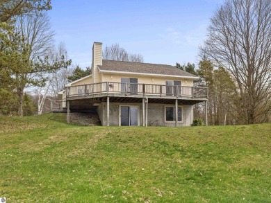 Nice 2 bedroom, 2 bath home that has seasonal views of Crystal on Crystal Lake Golf Club in Michigan - for sale on GolfHomes.com, golf home, golf lot