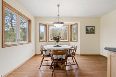 Nice 2 bedroom, 2 bath home that has seasonal views of Crystal on Crystal Lake Golf Club in Michigan - for sale on GolfHomes.com, golf home, golf lot