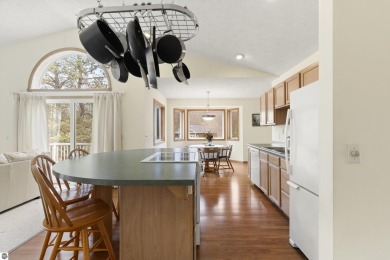 Nice 2 bedroom, 2 bath home that has seasonal views of Crystal on Crystal Lake Golf Club in Michigan - for sale on GolfHomes.com, golf home, golf lot