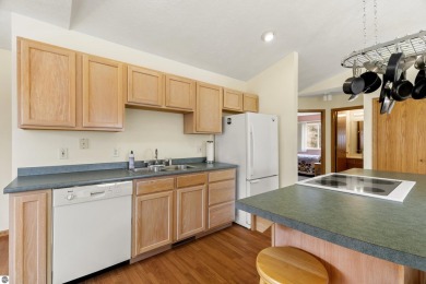 Nice 2 bedroom, 2 bath home that has seasonal views of Crystal on Crystal Lake Golf Club in Michigan - for sale on GolfHomes.com, golf home, golf lot