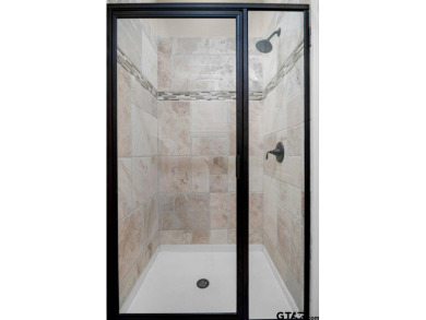 Discover an exceptional residence where sophisticated living on Hide-A-Way Lake Golf Course in Texas - for sale on GolfHomes.com, golf home, golf lot