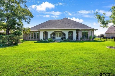 Discover an exceptional residence where sophisticated living on Hide-A-Way Lake Golf Course in Texas - for sale on GolfHomes.com, golf home, golf lot