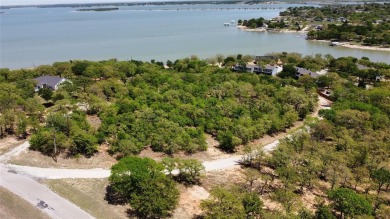 Stunning lakefront lot on a plateau overlooking lake Bridgeporte on The Club At Runaway Bay in Texas - for sale on GolfHomes.com, golf home, golf lot