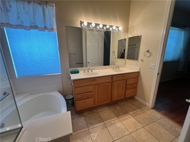 This beautiful home is well lit with many windows and an open on Ashwood Golf Course in California - for sale on GolfHomes.com, golf home, golf lot