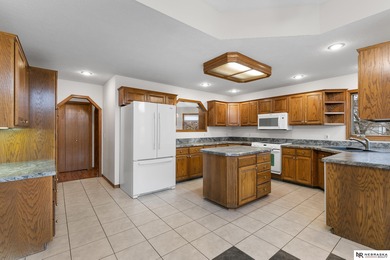 Experience the warmth of a close-knit neighborhood of around 100 on Woodland Hills Golf Course in Nebraska - for sale on GolfHomes.com, golf home, golf lot