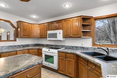 Experience the warmth of a close-knit neighborhood of around 100 on Woodland Hills Golf Course in Nebraska - for sale on GolfHomes.com, golf home, golf lot