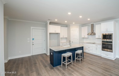 Location is everything, right? This brand new home is less than on Brick Landing Plantation Yacht and Golf Club in North Carolina - for sale on GolfHomes.com, golf home, golf lot