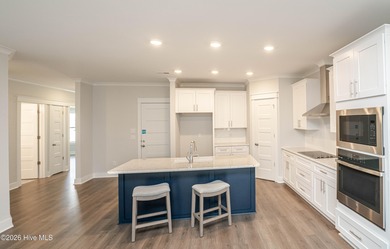 Location is everything, right? This brand new home is less than on Brick Landing Plantation Yacht and Golf Club in North Carolina - for sale on GolfHomes.com, golf home, golf lot