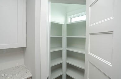 Location is everything, right? This brand new home is less than on Brick Landing Plantation Yacht and Golf Club in North Carolina - for sale on GolfHomes.com, golf home, golf lot