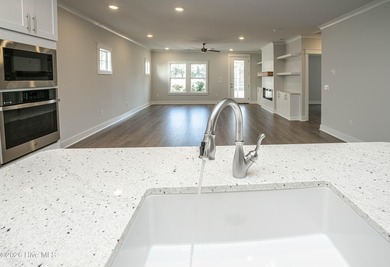 Location is everything, right? This brand new home is less than on Brick Landing Plantation Yacht and Golf Club in North Carolina - for sale on GolfHomes.com, golf home, golf lot